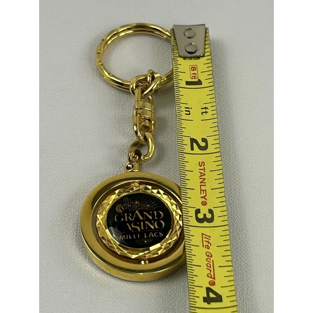 Vintage Grand Casino Mille Lacs Gold Tone Spinner Keychain Fob Souvenir